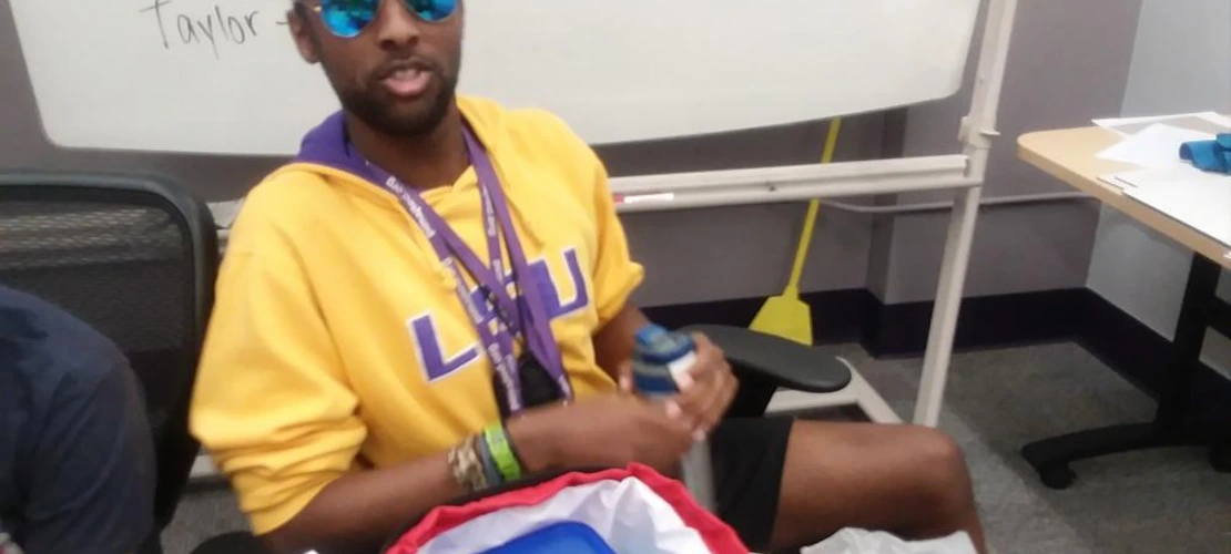 male student hanging out with aviators on