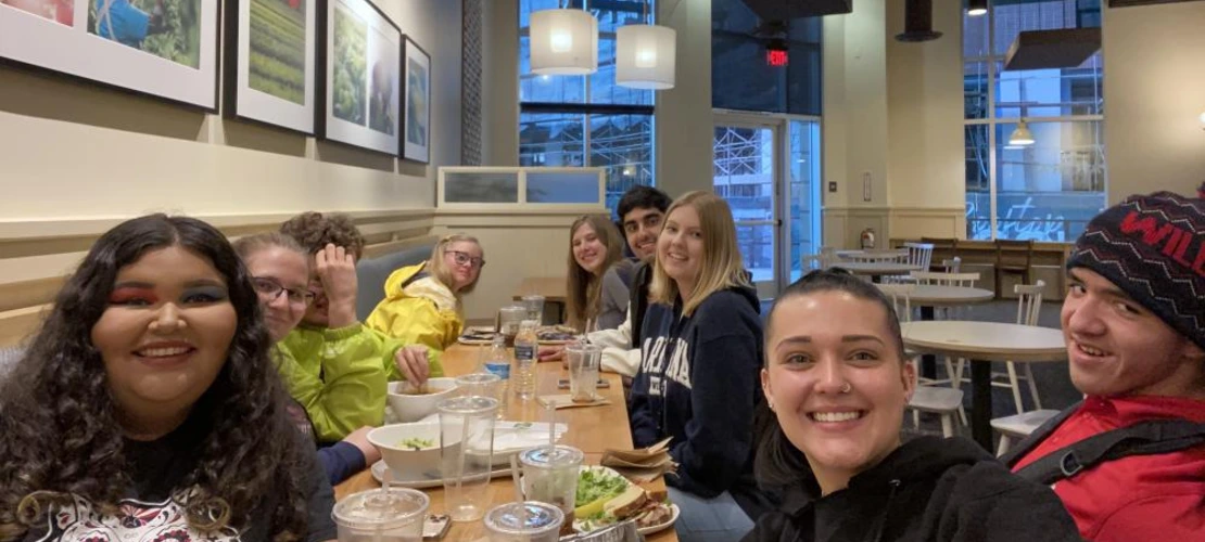 group of students eating lunch at Panera